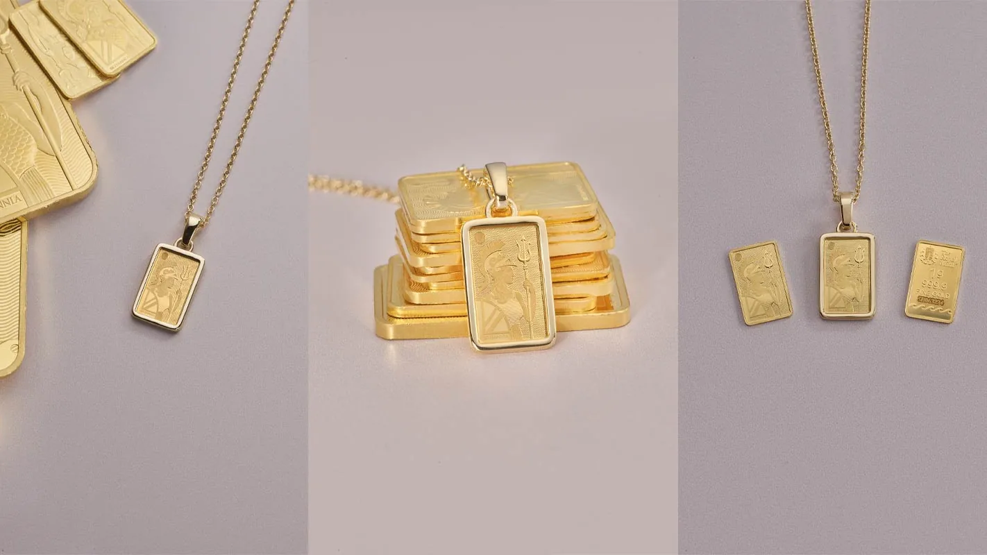The Royal Mint: Anhänger mit 1-Gramm-Britannia-Barren an einer Goldkette neben Goldbarren
